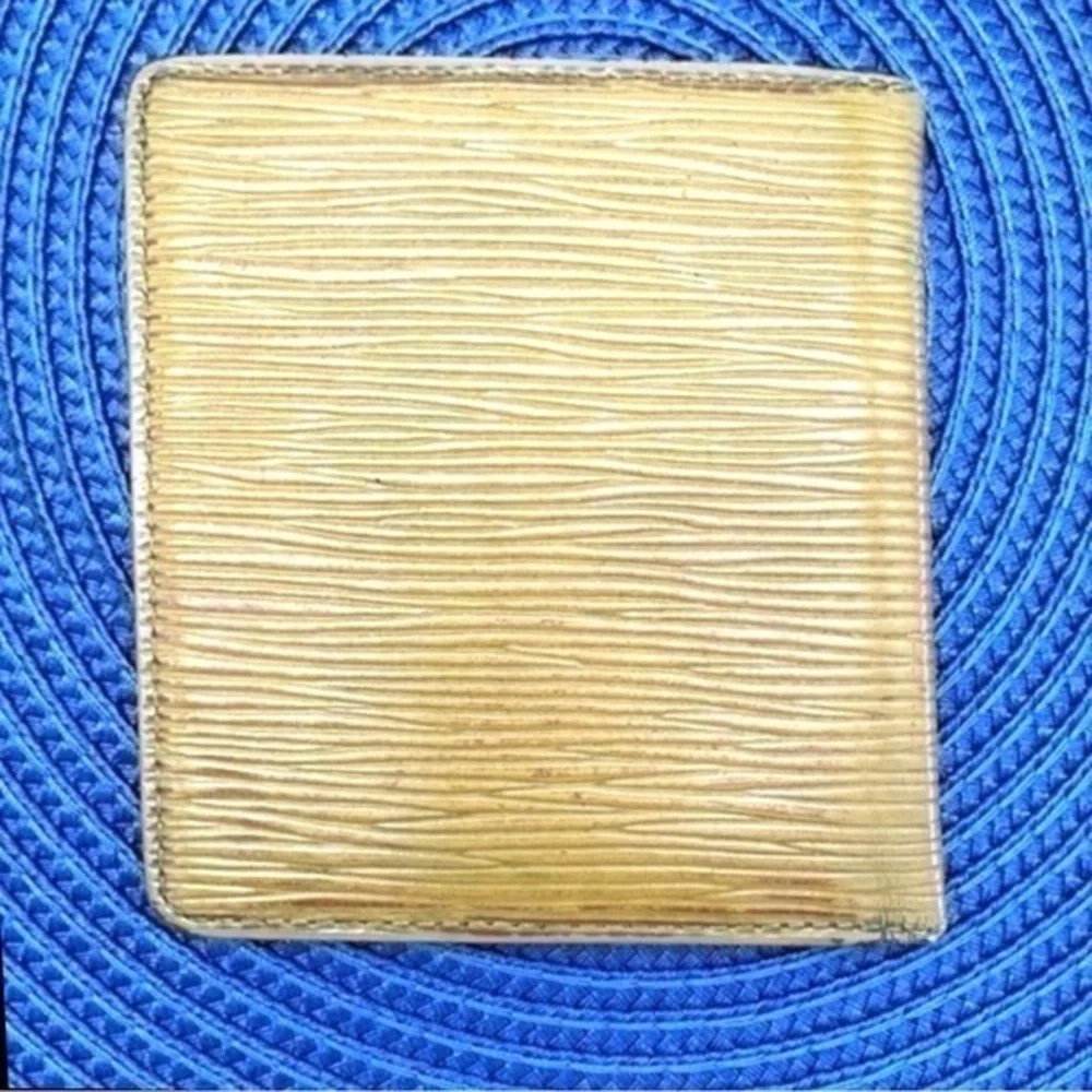 AUTHENTIC Louis Vuitton Marco Wallet. Previously owned. Light yellow.